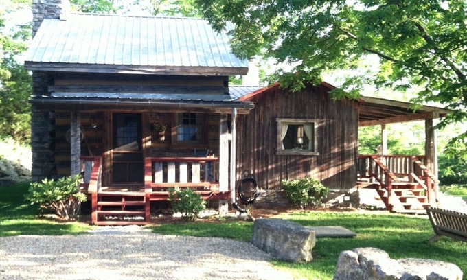 Madison Cabin | 1800’s restored log cabin on 26 private rolling wooded acres with sunset views