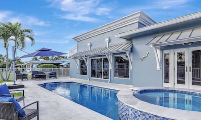 South New River Isles House | 3BR Waterfront Villa with Heated Pool, Spa, & Rooftop Deck