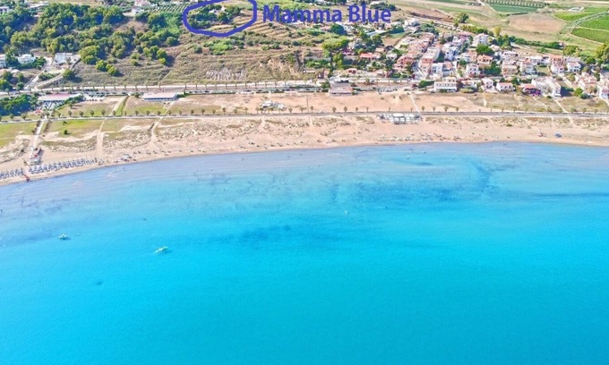 Porto Palo Villa | A balcony on the beach, pool, lush park
