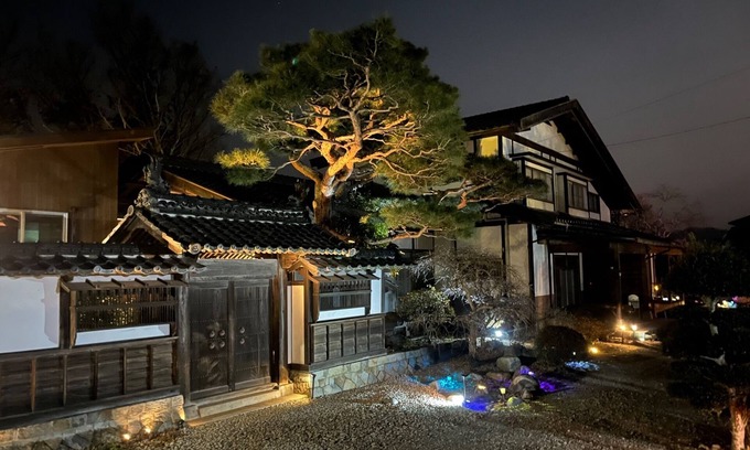 Matsukawa Cottage | A detached room with a cypress bath overlooking the garden and a large deck/Kitaazumigun Nagano