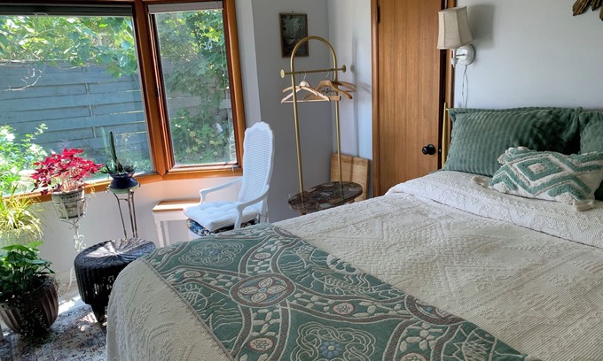 The Dalles Apartment | A shady retreat within a flower garden, with a boutique hotel feel. Close in