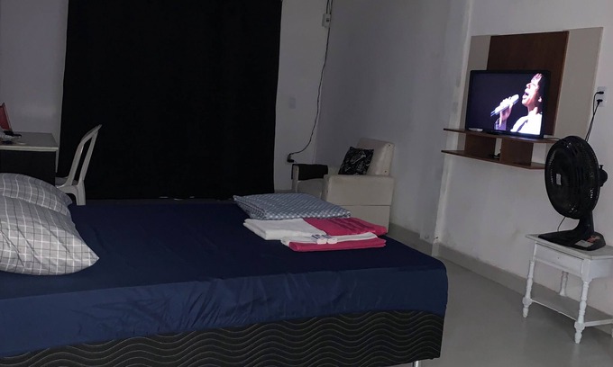 Araruama House | A street by the bus station, with air conditioning.