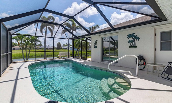 Pebble Beach House | Airy Canal-Front 3BR Home with Heated Pool Minutes to Beaches, Golf & Southwest Florida Adventures