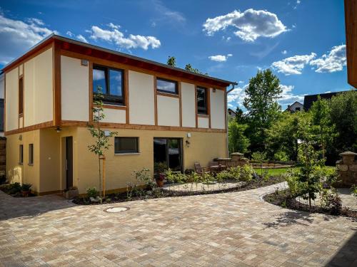 Hofheim in Unterfranken House | Amber Ferienhain - Ferienhaus 'Magnolie' mit verwunschenem Garten & privater Sauna