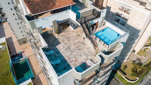 Enseada Apartment | APÊ COM PISCINA E AR - 2Q DA PRAIA DA ENSEADA.