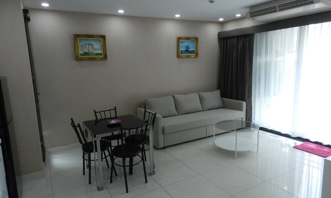 Jomtien Apartment | Apartment bedroom + living room.