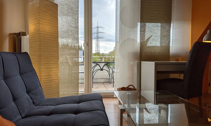 Wallersheim Apartment | Apartment 'Haus Abendsonne Dachgeschoss Klein' with Shared Garden, Balcony and Wi-Fi
