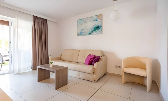 Cala Agulla Apartment | Apartment 'Standard 16' with Shared Pool, Wi-Fi and Air Conditioning