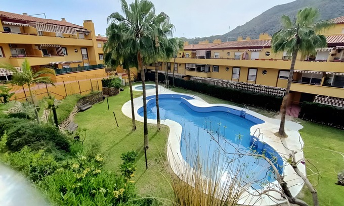 La Cala del Moral Apartment | Apartment 'Tu Oasis En Malaga' with Shared Pool and Wi-Fi