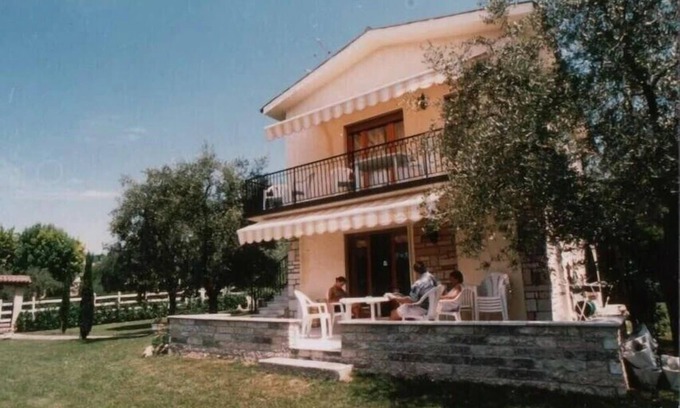 Bardolino Apartment | Apartment with sun terrace, large garden, communal pool, bathroom and guest WC