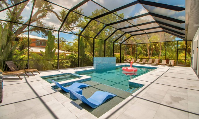 Arlington Park House | Arlington Oasis - Luxury 5 Bed Home, Heated Pool, E-bikes by Gulf Coast Holiday Homes