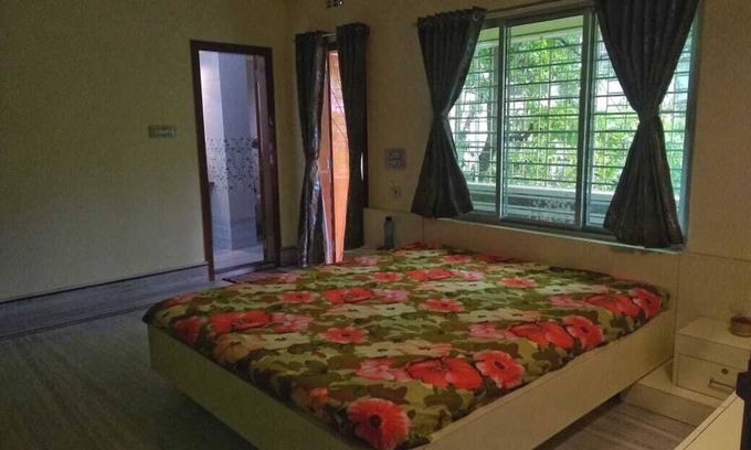 Siliguri Apartment | Bashundhara- A beautiful, spacious room with a bath and balcony.