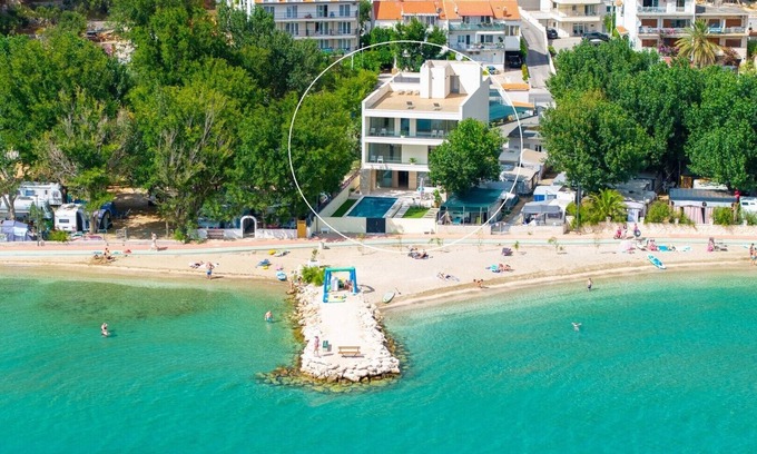 Duce Villa | Beachfront Villa Erce with private 40sqm heated pool, a Gym, 7 en-suite bedrooms, a rooftop terrace, 2 living areas