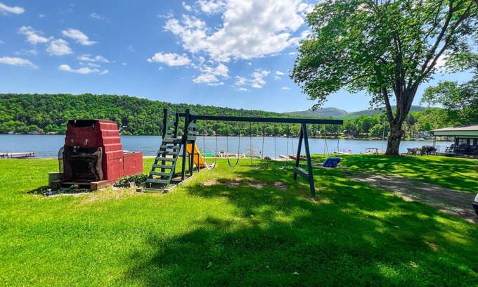 Wells Cottage | Beautiful and serene cottage with beach, dock, lake views, fishing, and A/C