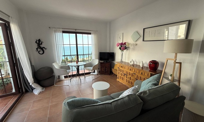 Chimenea Apartment | Beautiful apartment with aircon, large terrace, stunning sea views, shared pool