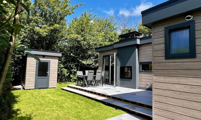 Sint Maartensvlotbrug House | Beautiful, brand new and uniquely designed chalet with pretty garden. Very spacious, modernly furnished for 5 people with luxurious "infinity" gas fireplace, wash-and-dryer and free WiFi.