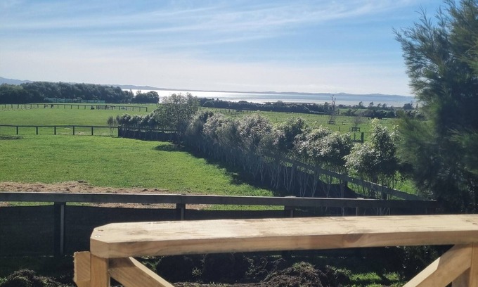 Clarks Beach Apartment | Beautiful harbour and rural farm views. Stunning views of sky tower and airport.
