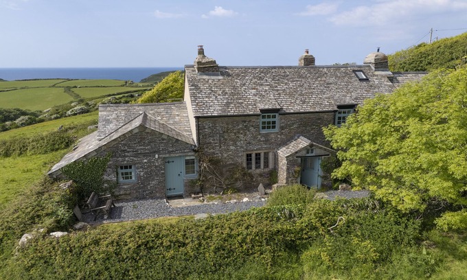 Trebarwith Cottage | Besloe is a beautifully preserved Grade II listed Cornish five bedroom home