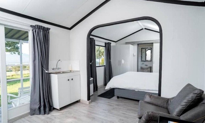 Hartbeespoort Ski Chalet | Black and White House