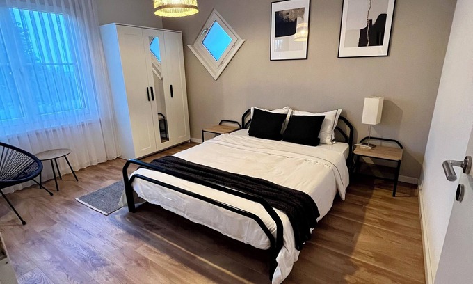 Oberuzwil Condo | Black & White Apartment