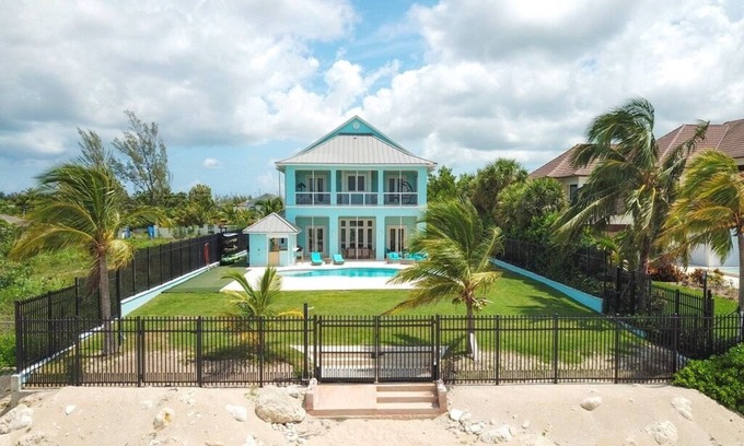 Coral Harbour House | Blue Birds Beach House, right on the beach with a large backyard & heated pool.