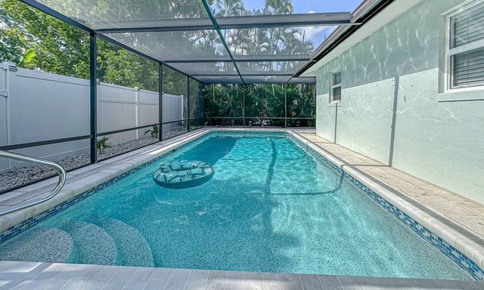 Fort Myers House | Bright and airy home with enclosed pool, hammock, and open-concept interior