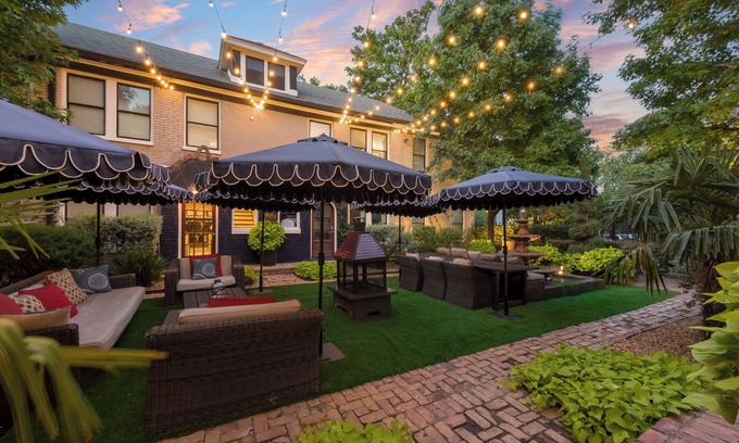 Old East Dallas Condo | Bright and refined 1BR condo on historic Swiss Avenue, featuring high-speed Wi-Fi, a plush queen bed, and a stylish living area with crystal lighting. Oversized windows fill the space with natural light, blending timeless charm with modern comfort.