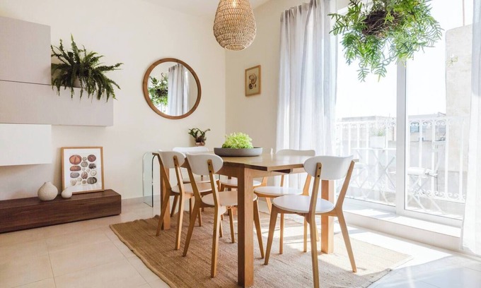 Ta' Pennellu Apartment | Bright and stylish 2-bedroom apartment in the heart of Mellieha, Malta. Located in a quiet residential area, it features a charming louvered balcony, large sunlit windows, and modern interiors with natural touches