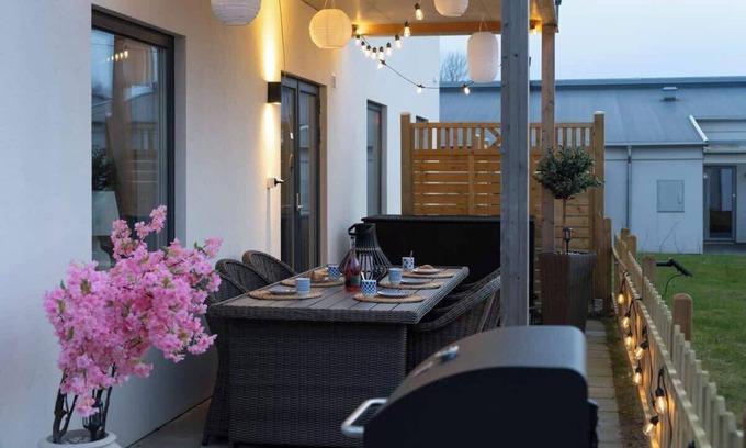 Bastad Condo | Bright Ground Floor Corner Home with Cozy Outdoor