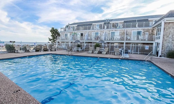 Falmouth Heights Resort | Captain's Quarters Resort Oceanfront suite, beautiful ocean view, swimming pool