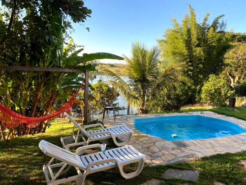 Ijaci House | Casa com piscina fundo pra represa e AR Condicionado CasinhaBrancaDeVaranda