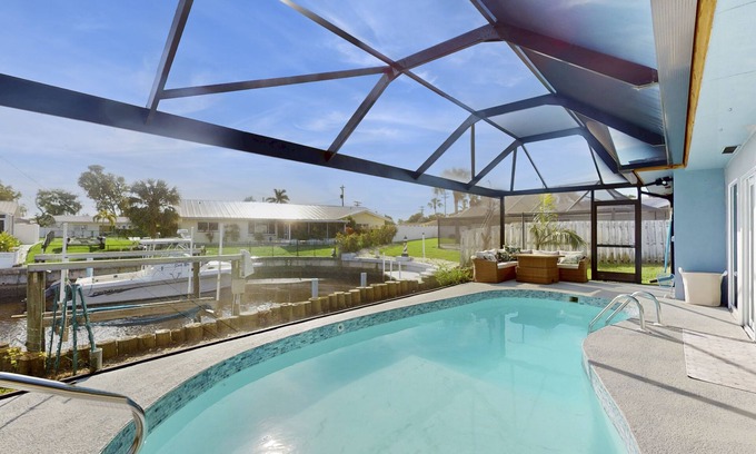 Lochmoor Waterway Estates House | Charming and sleek pool home, family friendly with canal access to river, WIFI