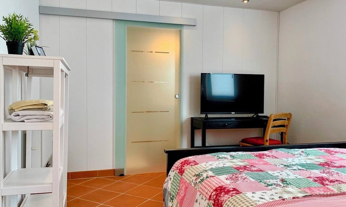 Altrip Apartment | Charming apartment with air conditioning, WiFi, smart TV surrounded by greenery