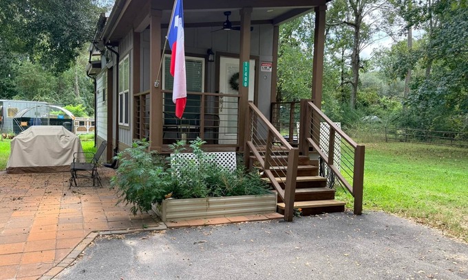 Conroe Cottage | Charming Tiny Home in Conroe with huge patio +grill & lots of green space.