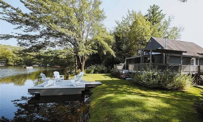 Ferndale House | Chic lakefront retreat with year-round charm. Enjoy Lake Barnabee views, a fully stocked kitchen, and cozy vibes in a nostalgic lake community. Kayak in summer, skate in winter, and take advantage of fun in-home concierge services.