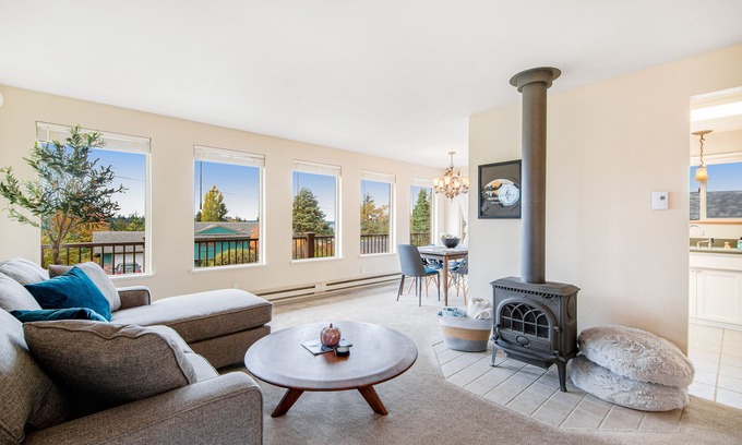 University Place House | Comfortable home with Puget Sound view, decks, garden patio, WiFi & W/D
