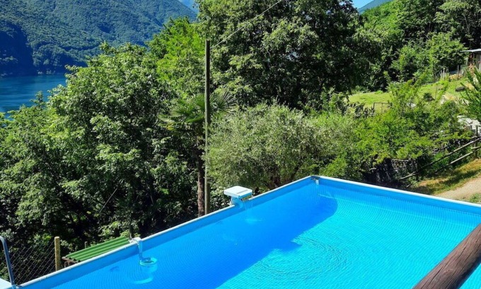 Porlezza House | Cosy apartment in villa for 4 guests with pool, WIFI, TV, patio, pets allowed and parking