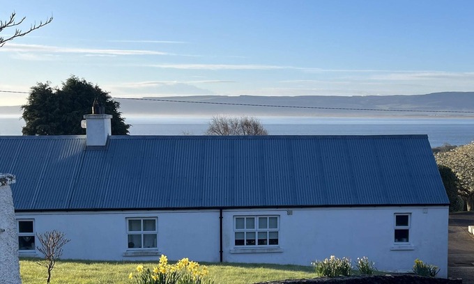 Greencastle Cottage | Cosy & comfortable cottage in private garden with panoramic sea views