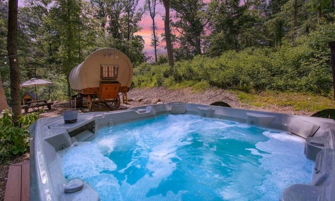 Strasburg RV Rental | Covered Wagon Camping w/Salt Water Hot Tub