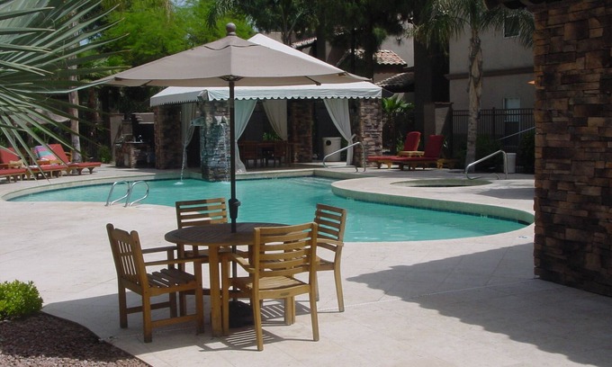 North Scottsdale Apartment | Cozy Condo Overlooking Lush Greens & A Palm Tree In Sunny Scottsdale