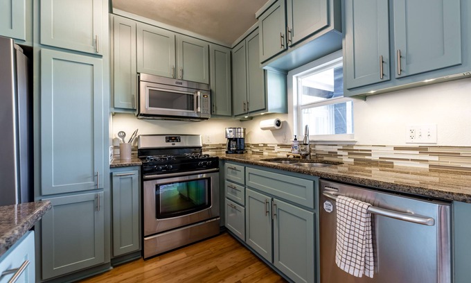 Galindo House | Cozy house, covered outdoor kitchen & living w/TV. Convenient location!