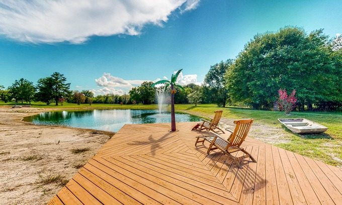 Waller House | Custom Home with Guesthouse, Pond, Swimming Deck, Beach & Tropical Bar