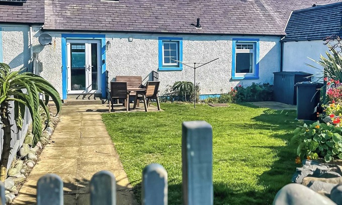 Drummore Cottage | Delightful cottage overlooking Luce Bay, with open fire and enclosed garden.