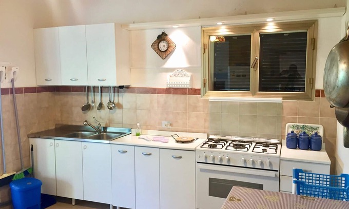 Poveromo Apartment | Detached bungalow-style house at 25m from the beach with 2.000m2 of privat garden around it. Air con