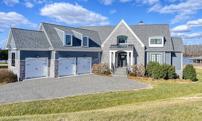 Livingston House | Elegant lakefront home with water access, hot tub, dock, rec room & fireplaces
