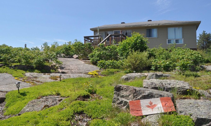 Britt Cottage | Entertainer's Dream Cottage! Waterfront, beach, steps to ice cream, marina, shop