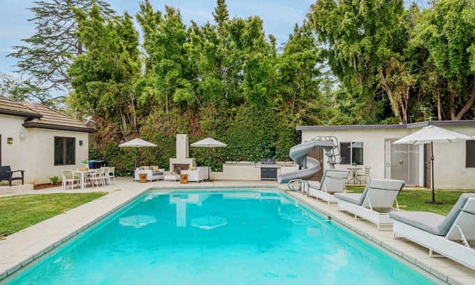 Sherman Oaks House | Exquisite Oasis Universal Pool slide laundry