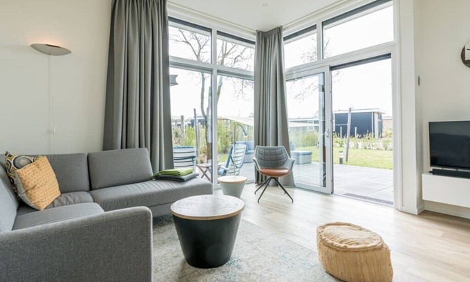 Burgh-Haamstede House | Extensive garden with spacious terraces and even space for a relaxing hammock. With the shade cloth