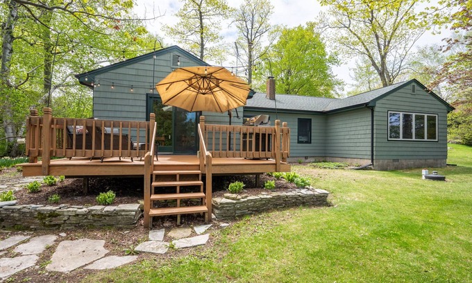 Little Sturgeon House | Fall Lakefront Retreat Dogs Fire Pit Views