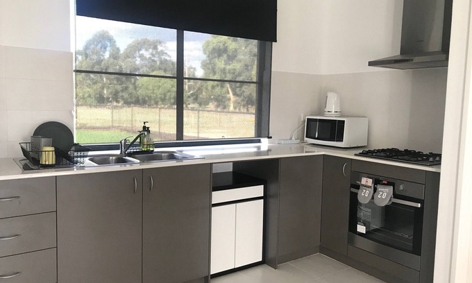 Oakford House | Family Farm Stay with Animals, Playground and Firepit